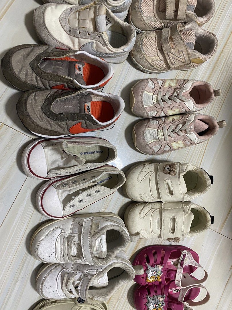 Bundle of Kids Shoes - Various Brands & Sizes (Category: Babies & Kids Fashion) located in Manila. Submitted by swiftmoon.a6f74e (Listing ID 1463581021, Image 3). Description: - Bundle of pre-loved kids' shoes - Includes sneakers, sandals, and clogs - Brands: Nike, Converse, New Balance (visible) - Closure types: Velcro straps and laces - Ideal for everyday wear and playtime - Please check photos for individual shoe details.