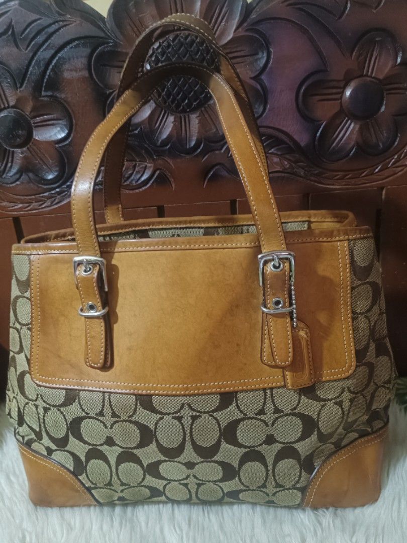 Bundled Coach Leather Handbag Purple (Category: Luxury Bags & Wallets) located in Cebu City. Submitted by elen30abalo (Listing ID 1462990500, Image 2). Description: - Purple Coach handbag - Made from luxurious full-grain cowhide leather - Stylish brown leather handles - Elegant gold hardware - Spacious interior with multiple compartments - Trendy slouchy silhouette - Crafted in China - Serial Number: NP-F0873-12476.