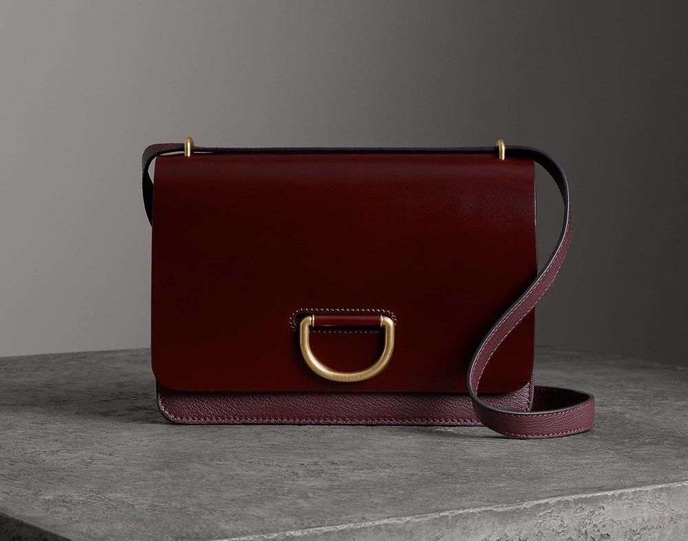 Burberry D-Ring Leather Crossbody Bag (Category: Luxury Bags & Wallets) located in General Trias. Submitted by lexluxebizz (Listing ID 1463613289, Image 1). Description: Burberry D-Ring Leather Crossbody Bag Made in Italy. (Original Price: Php 165,000++) THE DETAILS Highlights - Leather - Fold -over top - Flip-lock fastening - Partitioned compartment - Internal patch pockets - Gold-tone Hardware - Condition: EXCELLENT, like NEW. This previously o