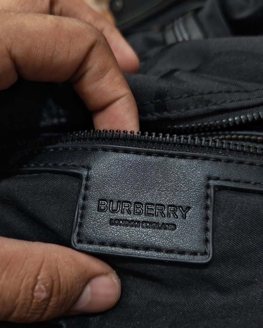 Burberry Monogram Duffel Bag (Category: Luxury Bags & Wallets) located in Baguio. Submitted by solo_ukay (Listing ID 1463694671, Image 3). Description: - Authentic Burberry duffel bag - All-over signature monogram print - Secure zip closure - Comfortable dual top handles - Detachable shoulder strap for versatile carrying - Durable blend of nylon and polyamide material - Ideal for travel, gym, or everyday use.