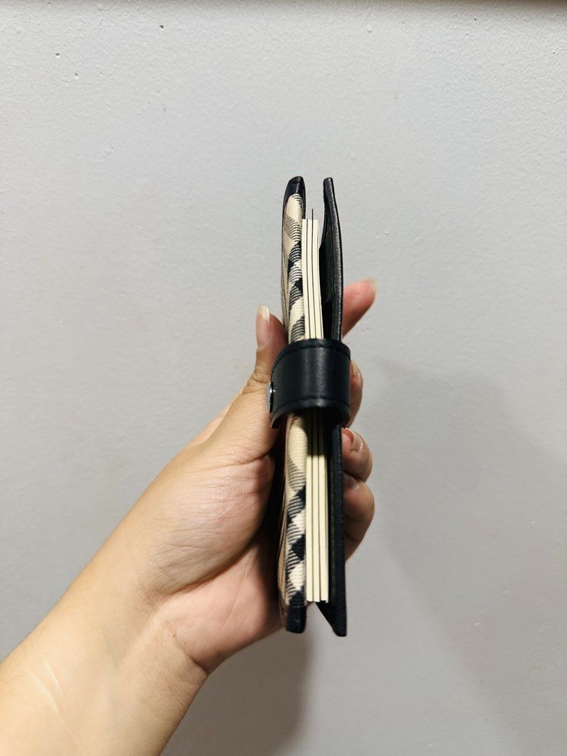 Burberry Planner/Card holder (Category: Wallets & Card holders) located in Batangas. Submitted by stopandshopforluxury (Listing ID 1463736748, Image 3). Description: Guaranteed Original 💯 No flaws, can send more photos upon request. What you see is what you get. Shipping via Lalamove, J&T, and LBC Disclaimer: This is a preloved bag. Actual condition is shown in photos. Expect normal signs of wear. Colors may slightly vary due to lighting. Please