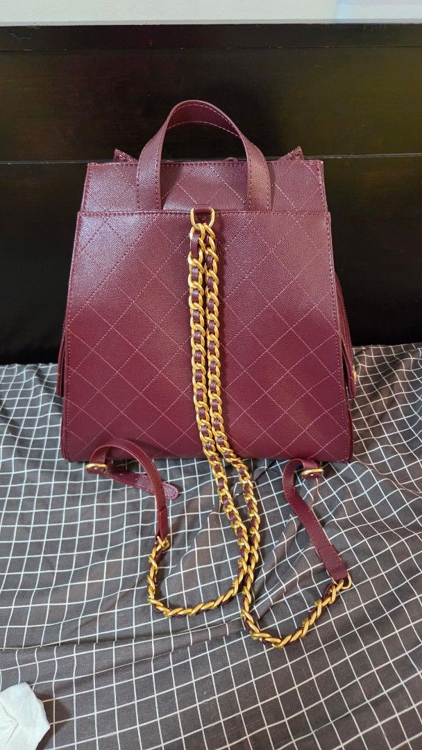 Burgundy Quilted Leather Chain Backpack (Category: Luxury Bags & Wallets) located in Quezon City. Submitted by jeckaloca03 (Listing ID 1463600638, Image 3). Description: no issue - Burgundy quilted leather backpack - Gold chain straps - Secure drawstring closure - Front flap pocket with iconic CC logo - Interior slip pockets for organization - Ideal for everyday errands or travel adventures.