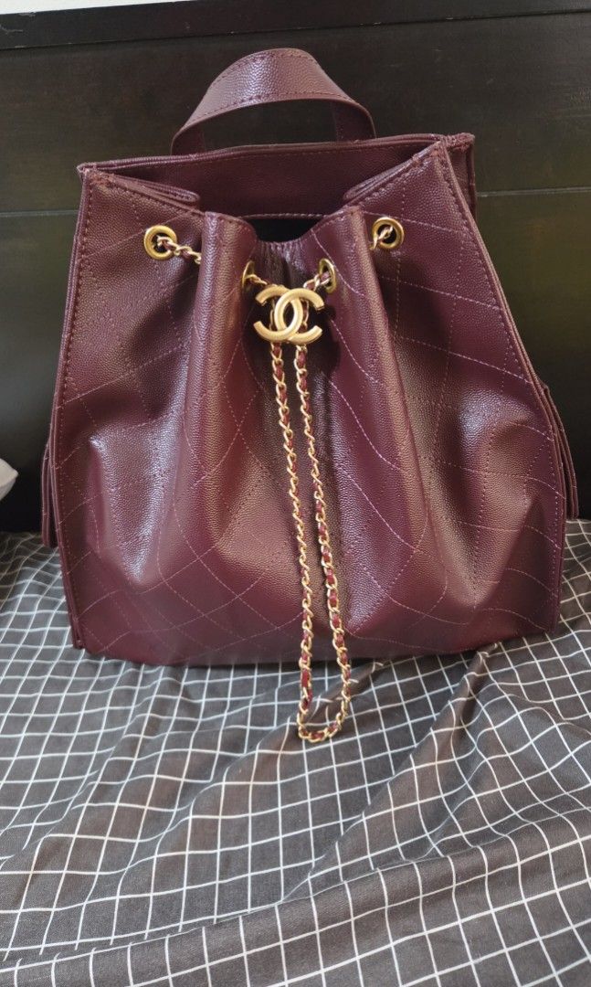 Burgundy Quilted Leather Chain Backpack (Category: Luxury Bags & Wallets) located in Quezon City. Submitted by jeckaloca03 (Listing ID 1463600638, Image 1). Description: no issue - Burgundy quilted leather backpack - Gold chain straps - Secure drawstring closure - Front flap pocket with iconic CC logo - Interior slip pockets for organization - Ideal for everyday errands or travel adventures.