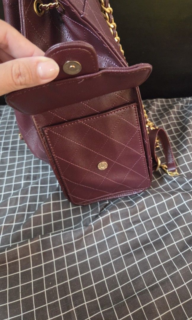 Burgundy Quilted Leather Chain Backpack (Category: Luxury Bags & Wallets) located in Quezon City. Submitted by jeckaloca03 (Listing ID 1463600638, Image 2). Description: no issue - Burgundy quilted leather backpack - Gold chain straps - Secure drawstring closure - Front flap pocket with iconic CC logo - Interior slip pockets for organization - Ideal for everyday errands or travel adventures.