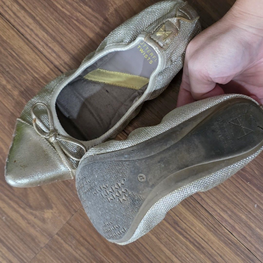 Ballet Flats Butterfyl Twists Gold (Category: Flats & Sandals) located in Manila. Submitted by my23686 (Listing ID 1463632292, Image 3). Description: - Gold ballet flats from Butterfly Twists - Chic pointed toe with a cute bow detail - Elasticated sides ensure a snug and comfortable fit - Effortless slip-on design for convenience - Ideal for everyday wear and travel.
