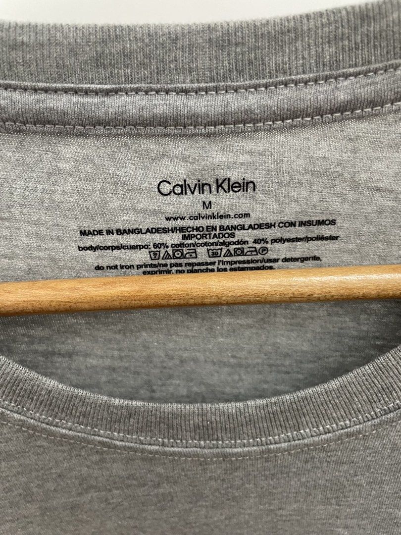 Calvin Klein Grey T-Shirt (Category: Tshirts & Polo Shirts ) located in San Fernando. Submitted by migifinds (Listing ID 1463659488, Image 3). Description: - Brand: Calvin Klein - Color: Grey - Size: Medium (M) - Material: Cotton Microfiber Blend - Condition: Brand New with Original Tag Attached - Features: Crew neck, short sleeves, subtle front logo, plain back - Brand new with tag attached Pm me for more details 📩 .