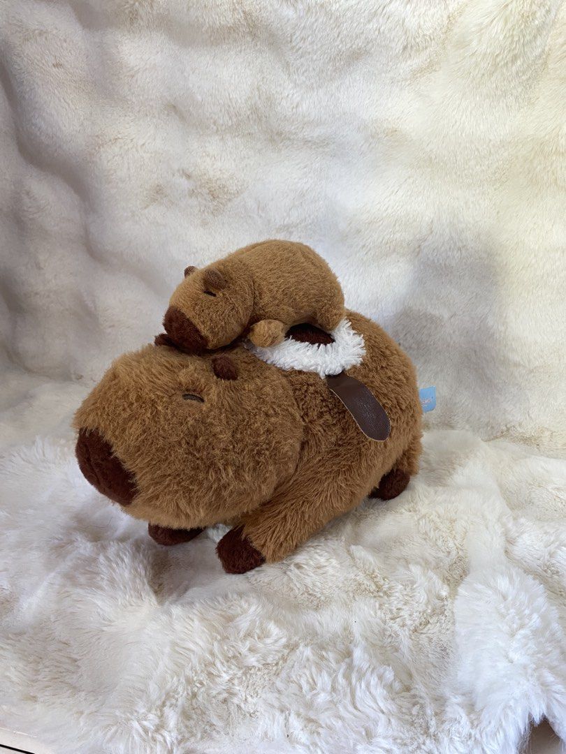 Capybara with baby capybara on top pull-string vibration plush (Category: Plushies & Soft Toys) located in Kalibo. Submitted by ollie_stuffshop (Listing ID 1463634114, Image 1). Description: Estimated shipping fee: 85 php Will refund the change if the actual Sf is less than the ESF. But if the actual SF exceed the ESF, the additional balance needs to be settled..