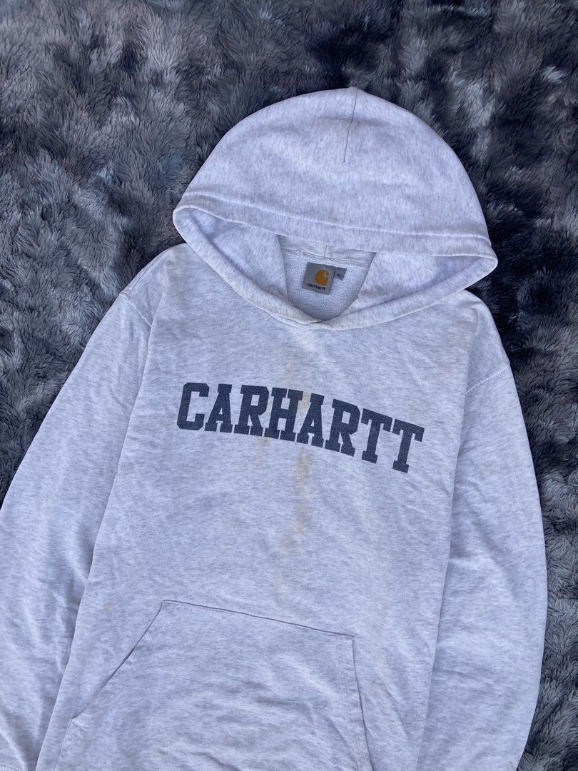 CARHARTT COLLEGE SCRIPT - OUT PULL OVER HOODIE ( GRAY ) (Category: Coats, Jackets and Outerwear) located in Santa Cruz. Submitted by jazt_thrift_22 (Listing ID 1463707138, Image 3). Description: CARHARTT COLLEGE SCRIPT - OUT PULL OVER HOODIE ( GRAY ) Length “29 Width “25 Fair to good condition Color rate 9.5 / 10 With major flaws — Minimal distressed, tiny pinholes & soysauce stains - ₱680 + Shipping fee ! 🛒 Laguna, sta cruz 📍.