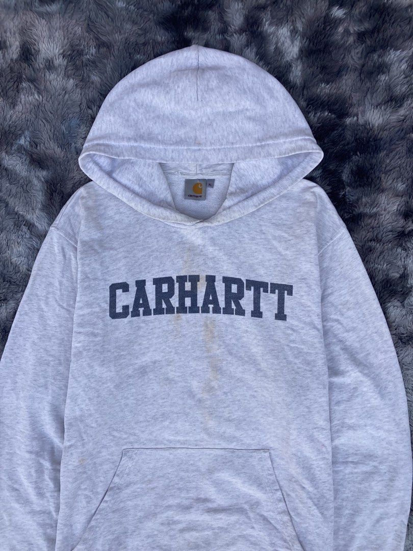 CARHARTT COLLEGE SCRIPT - OUT PULL OVER HOODIE ( GRAY ) (Category: Coats, Jackets and Outerwear) located in Santa Cruz. Submitted by jazt_thrift_22 (Listing ID 1463707138, Image 2). Description: CARHARTT COLLEGE SCRIPT - OUT PULL OVER HOODIE ( GRAY ) Length “29 Width “25 Fair to good condition Color rate 9.5 / 10 With major flaws — Minimal distressed, tiny pinholes & soysauce stains - ₱680 + Shipping fee ! 🛒 Laguna, sta cruz 📍.
