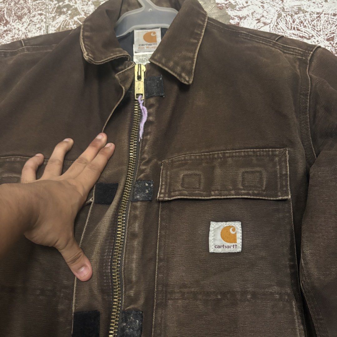 Carhartt For Women Brown Canvas Work Jacket (Category: Coats, Jackets and Outerwear) located in Ajuy. Submitted by reeyn0515 (Listing ID 1463578850, Image 2). Description: - Brand: Carhartt - Color: Brown - Style: Work Jacket - Material: Durable Cotton Duck Canvas - Lining: Quilted for warmth - Pockets: 2 chest pockets, 2 hand pockets - Closure: Zipper and snap - Size: Medium - Ideal for: Work or everyday wear - 23x27.