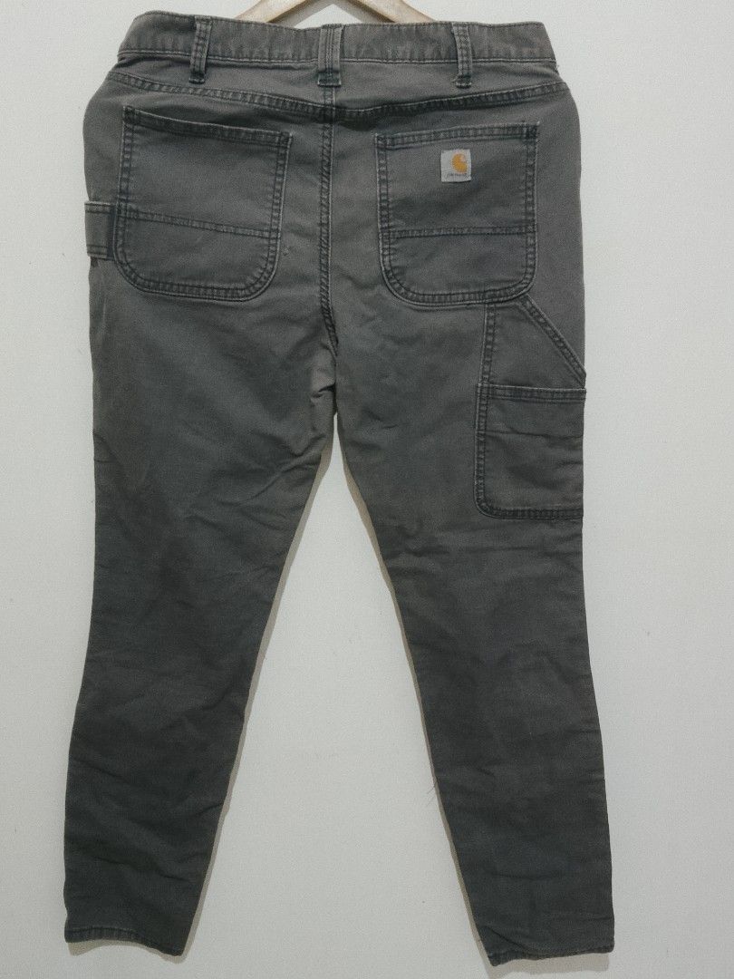 Carhartt Slim Fit Work Pants Grey Size 10 Regular (Category: Jeans) located in Manila. Submitted by juan.hundred04 (Listing ID 1463647520, Image 1). Description: - Grey Carhartt work pants - Slim fit, size 10 regular - Classic carpenter style with multiple pockets - Durable material, suitable for work or casual wear - Made in China.