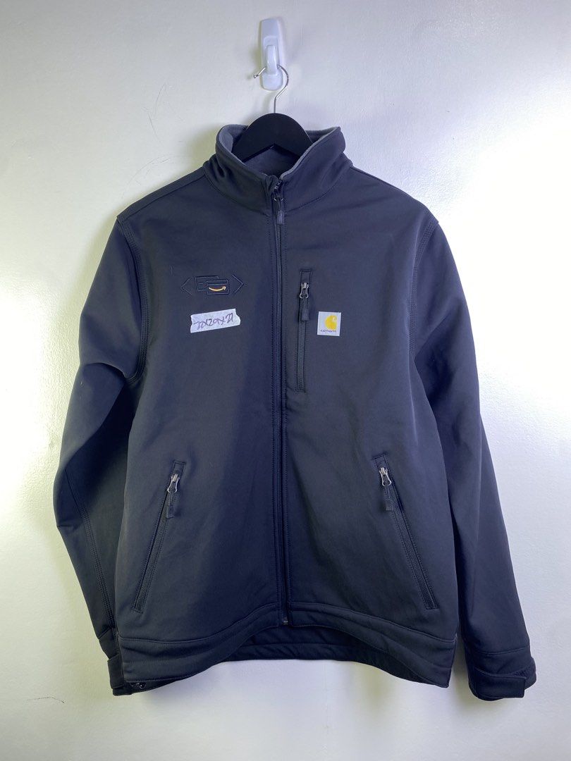 Carhartt Softshell Jacket with Amazon Logo (Category: Coats, Jackets and Outerwear) located in Manila. Submitted by declutterpromax (Listing ID 1463606144, Image 1). Description: - Dark navy Carhartt softshell jacket - Features Carhartt logo on chest - Includes embroidered Amazon logo on left chest - Multiple zippered pockets for secure storage - Versatile for work or casual wear - All zippers function smoothly.