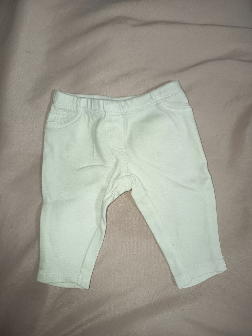 Carters Newborn Baby Pants (Category: Babies & Kids Fashion) located in Jose Panganiban. Submitted by louisecheese (Listing ID 1463581787, Image 2). Description: - Brand: Carter's - Size: Newborn - Color: Light Green - Material: Soft and stretchy for ultimate comfort - Features: Elastic waistband for easy dressing - Perfect for: Everyday wear - Bonus: Comes with a matching pair of socks and a wooden teething ring.