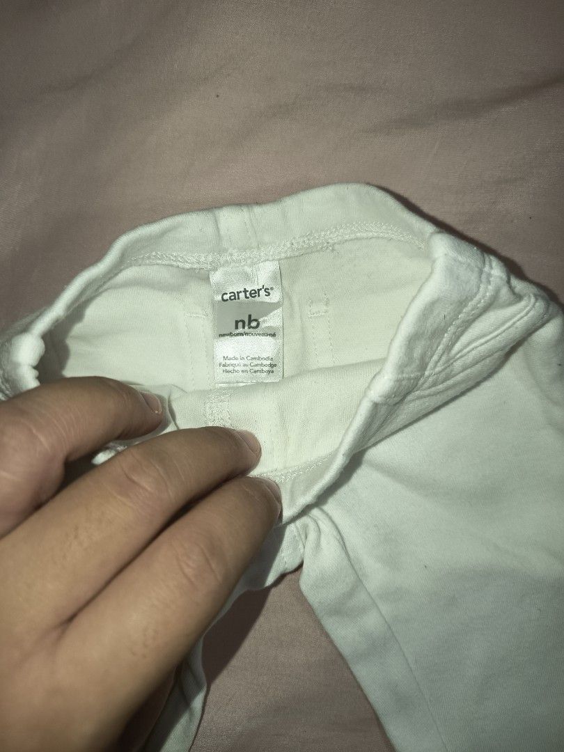 Carters Newborn Baby Pants (Category: Babies & Kids Fashion) located in Jose Panganiban. Submitted by louisecheese (Listing ID 1463581787, Image 3). Description: - Brand: Carter's - Size: Newborn - Color: Light Green - Material: Soft and stretchy for ultimate comfort - Features: Elastic waistband for easy dressing - Perfect for: Everyday wear - Bonus: Comes with a matching pair of socks and a wooden teething ring.