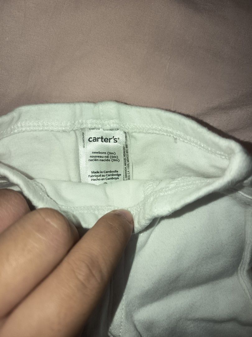 Carters White Baby Pants NB (Category: Babies & Kids Fashion) located in Jose Panganiban. Submitted by louisecheese (Listing ID 1463581678, Image 3). Description: - Soft white baby pants - Comfortable elastic waistband - Faux front pockets for style - Ideal for everyday wear - Easy to put on and take off.