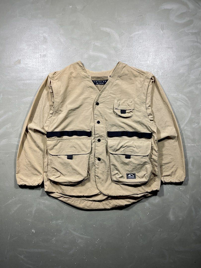 Catalog Multi-Pocket Removable Sleeves Utility Jacket/Vest (Category: Coats, Jackets and Outerwear) located in Baguio. Submitted by highland.archives (Listing ID 1463741097, Image 1). Description: Catalog utility Pristine condition Width: 23" Length: 27" Shoulders: 20" Sleeve length: 23" Hem: 25".