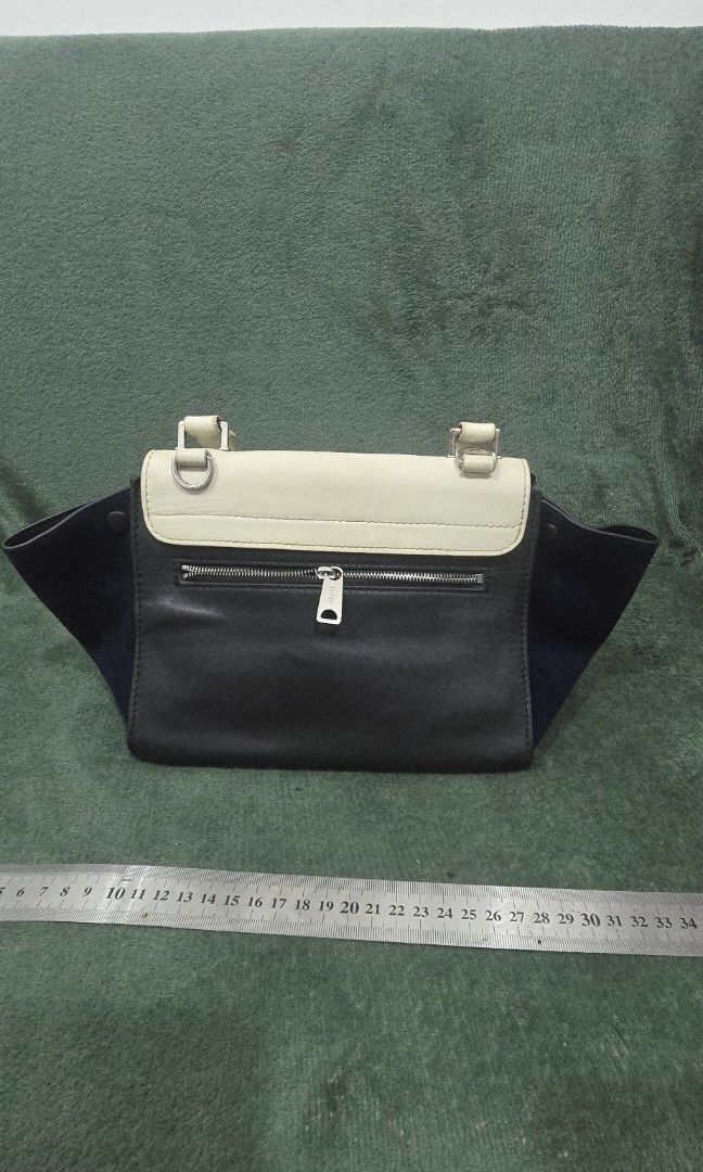 Celine Deep Sea Tricolor Trapeze Bag (Category: Luxury Bags & Wallets) located in Bacoor. Submitted by deux_trading_corporation (Listing ID 1463705253, Image 2). Description: 50k and above on 2ndhand market. condition: Rank AB - has normal signs of wear but no damage whatsoever. needs bags spa. payment first. you can always ask for discount/tawad but no to sobrang barat. no reservation. always check all the photos. some photo/s indicate the flaw.