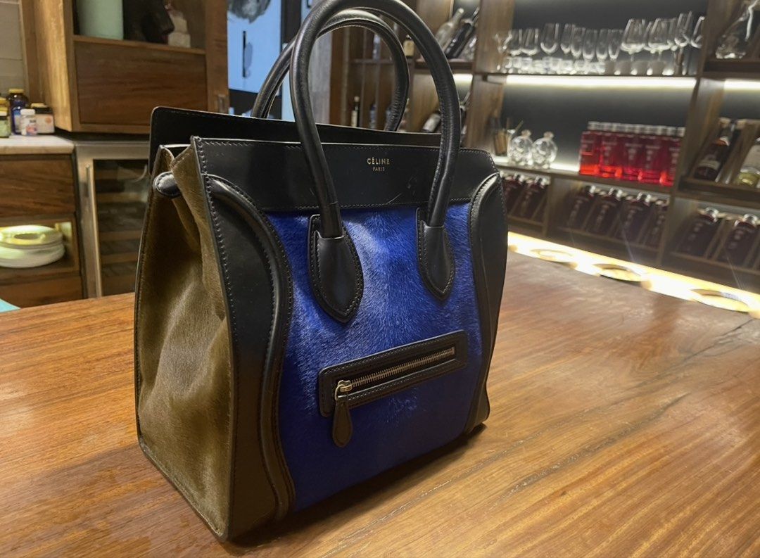 Celine Large Tote Bag (Category: Luxury Bags & Wallets) located in Quezon City. Submitted by vaugncruz08 (Listing ID 1463590577, Image 1). Description: - Authentic Celine Large Luggage tote - Chic blue and black colorway - Luxurious leather and pony hair details - Convenient front zipper pocket - Sturdy double top handles - Ideal for everyday use - Slightly negotiable .