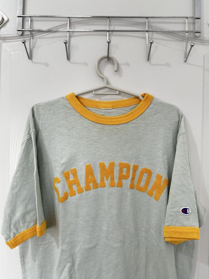 Champion light blue Ringer T-Shirt (Category: Announcements) located in Manila. Submitted by driftthrift (Listing ID 1463611508, Image 1). Description: - light blue Champion ringer t-shirt - Yellow trim on collar and sleeves - Champion logo prominently displayed across the chest - Small Champion logo detail on the sleeve - Ideal for everyday casual wear.