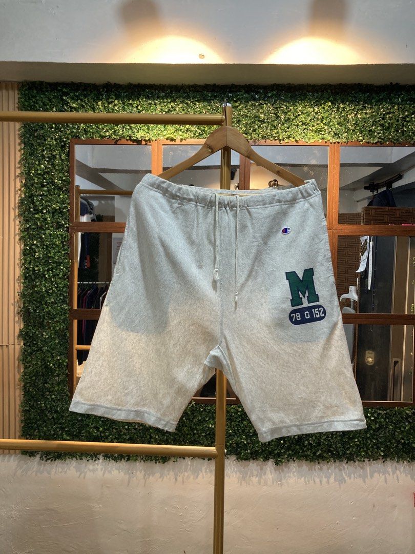 Champion Grey Sweat Shorts with M Logo (Category: Shorts) located in Trece Martires City. Submitted by thriftkoto.91 (Listing ID 1463700311, Image 1). Description: - Grey Champion sweat shorts - Green 'M' logo with '78 G 152' detail on left leg - Elastic waistband with adjustable drawstring - One back pocket on the right side - Perfect for comfortable, casual wear.