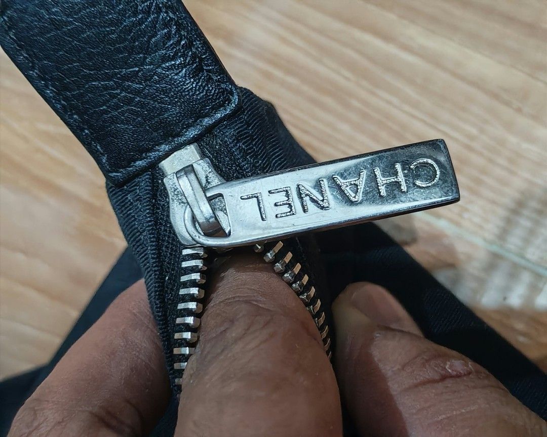 Chanel Black Fabric Bag with Silver Zipper (Category: Luxury Bags & Wallets) located in Baguio. Submitted by solo_ukay (Listing ID 1463694137, Image 2). Description: - Stylish black fabric bag - Smooth-working silver zipper with authentic Chanel branding - Branded zipper pull for added detail - Ideal for casual, everyday use - Perfect size for carrying your daily essentials.