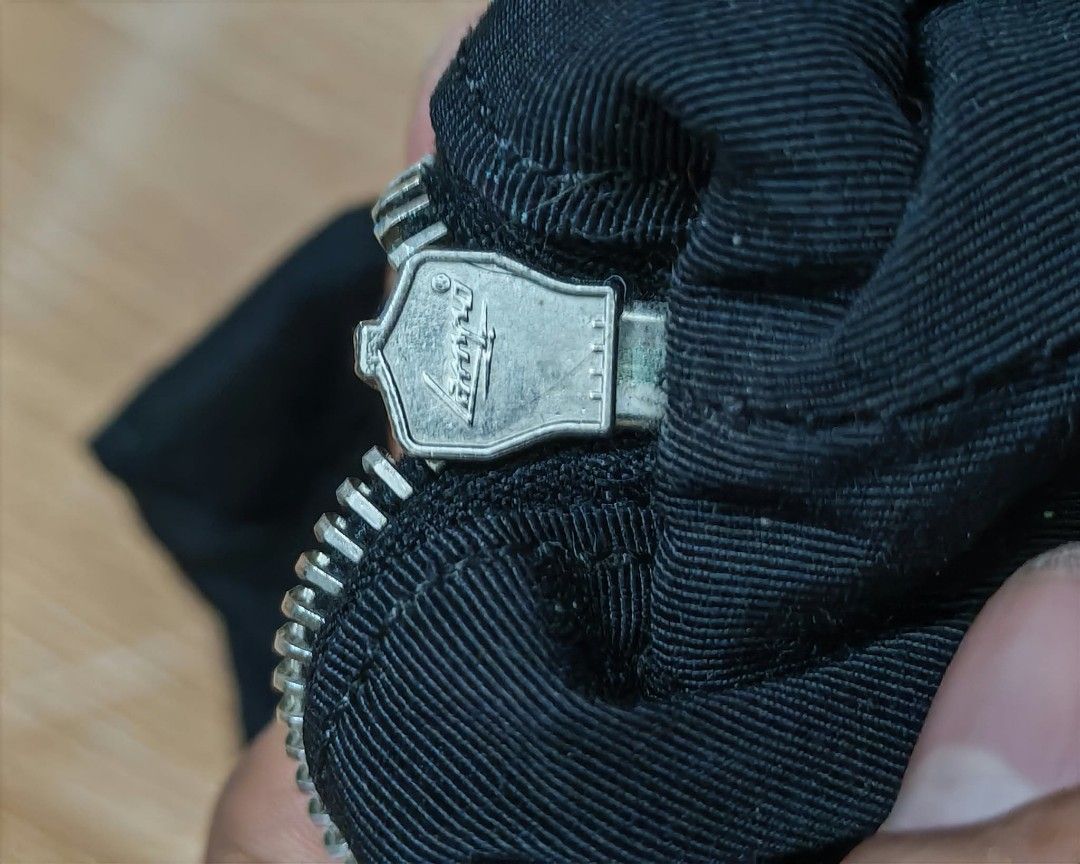 Chanel Black Fabric Bag with Silver Zipper (Category: Luxury Bags & Wallets) located in Baguio. Submitted by solo_ukay (Listing ID 1463694137, Image 3). Description: - Stylish black fabric bag - Smooth-working silver zipper with authentic Chanel branding - Branded zipper pull for added detail - Ideal for casual, everyday use - Perfect size for carrying your daily essentials.