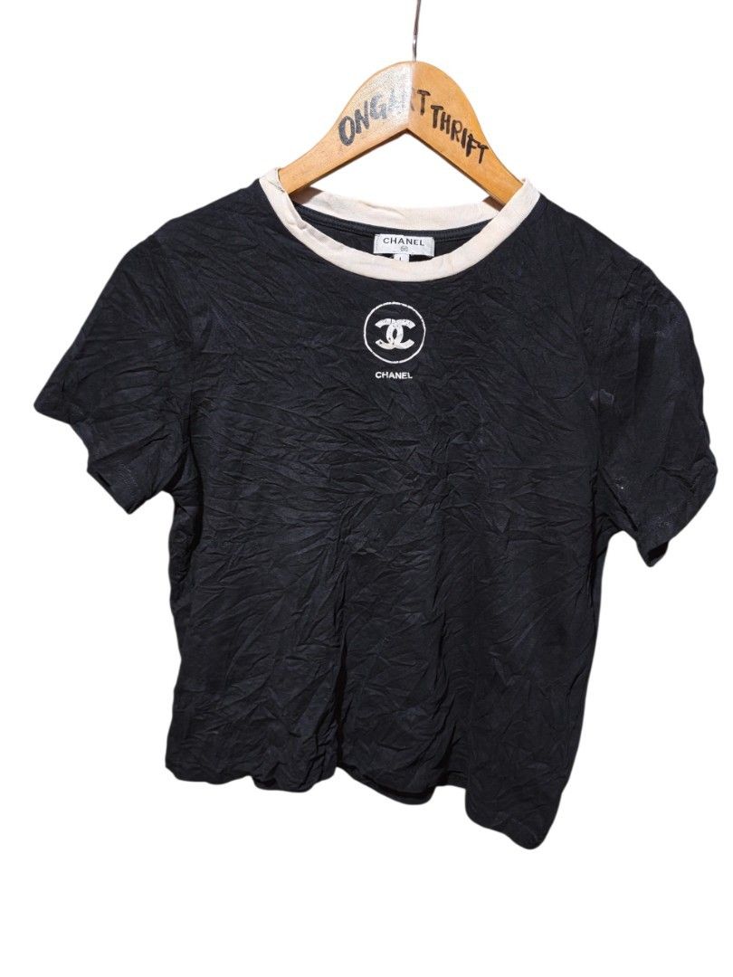 Chanel Black T-Shirt Size L (Category: Shirts) located in Maasim. Submitted by ukayganda25 (Listing ID 1463656799, Image 1). Description: - Authentic Chanel T-shirt - Color: Black with white neckline trim - Features iconic Chanel CC logo - Size: L - Material: 100% Cotton - Made in Italy - Ideal for casual wear -need wash -19*20.5 dimensions .