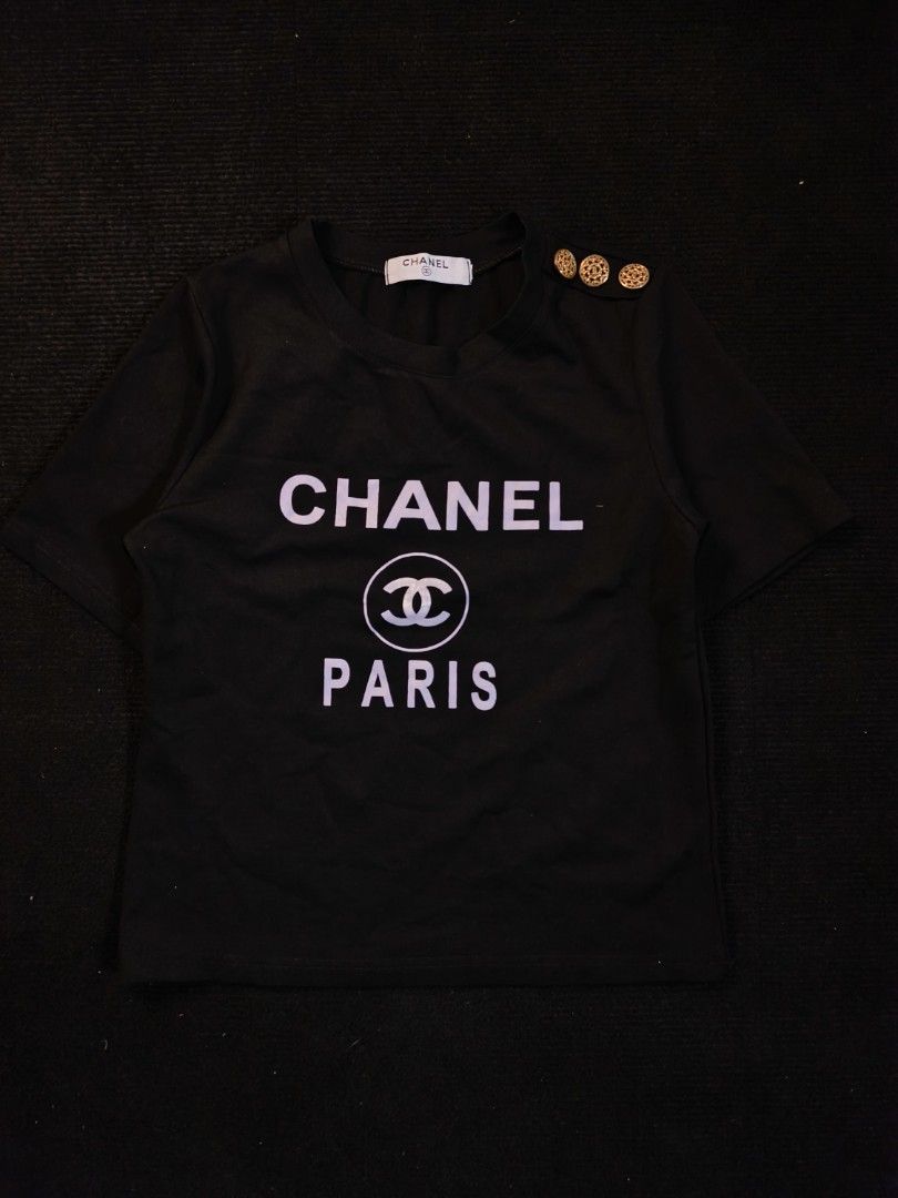 Chanel Paris Big Logo (Category: Shirts) located in San Fernando. Submitted by gaboo_asncn (Listing ID 1463711937, Image 2). Description: - Chanel Paris Big Logo - Size: Small (W16.5/L20) - Conditon: Excellent - Color Rate: 9.5/10 - No issue.