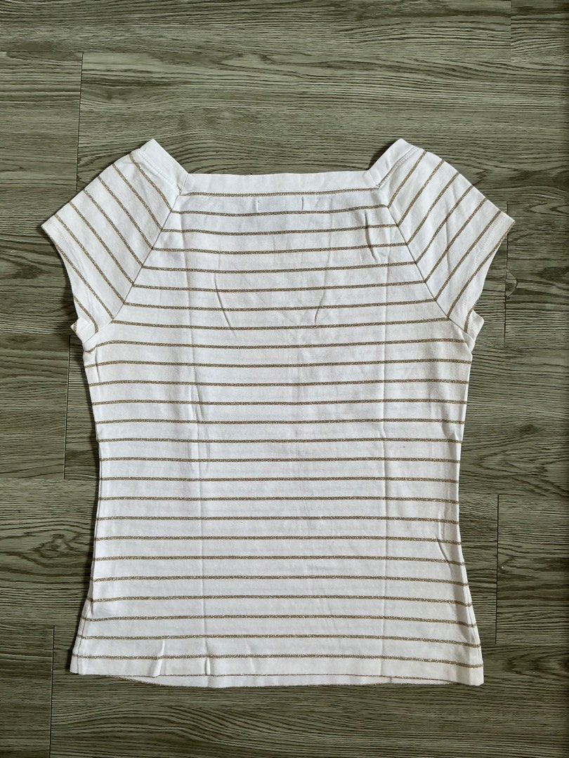Chaps White Striped Square Neck T-Shirt Size S (Category: Shirts) located in Muntinlupa City. Submitted by lovedbysabel (Listing ID 1463644345, Image 3). Description: - Brand: Chaps - Color: White with thin gold stripes - Neckline: Square - Sleeves: Short - Material: Cotton blend - Size: S - Condition: Good, with a small stain on the front (visible in the last photo).