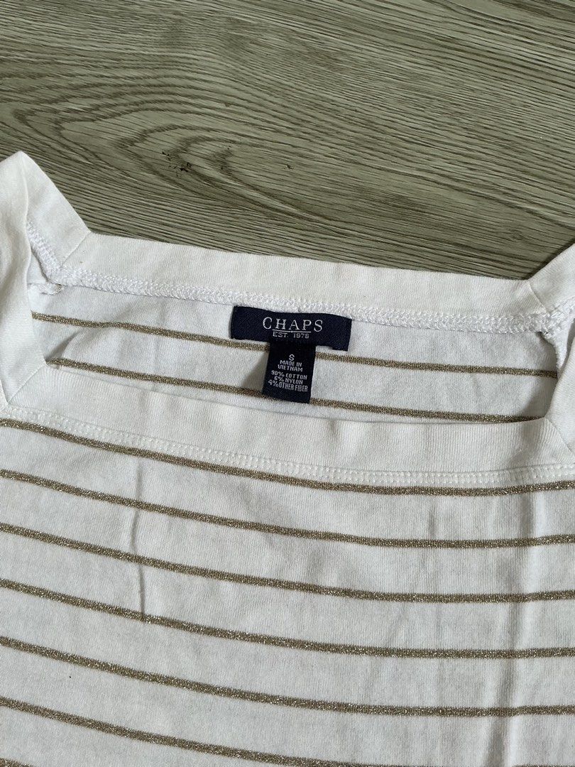 Chaps White Striped Square Neck T-Shirt Size S (Category: Shirts) located in Muntinlupa City. Submitted by lovedbysabel (Listing ID 1463644345, Image 1). Description: - Brand: Chaps - Color: White with thin gold stripes - Neckline: Square - Sleeves: Short - Material: Cotton blend - Size: S - Condition: Good, with a small stain on the front (visible in the last photo).