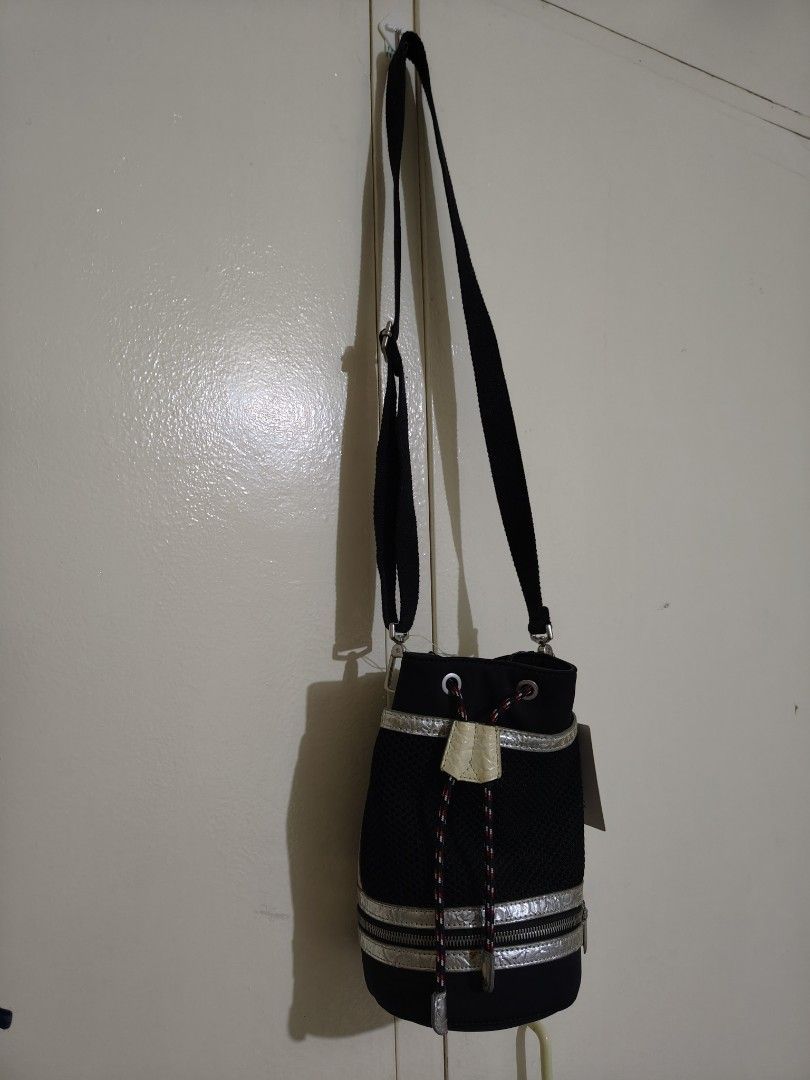 CHARLES & KEITH BUCKET CROSD BODY BAG (Category: Cross-body Bags) located in Cainta. Submitted by relove.finds_2020 (Listing ID 1463714927, Image 2). Description: - CHARLES & KEITH BUCKET CROSS BODY BAG - WITH TAG (NOT USED| JUST KEPT) - MINOR ISSUE: SILVER TRIM HAS FADED - STILL STURDY AND FULLY FUNCTIONAL.