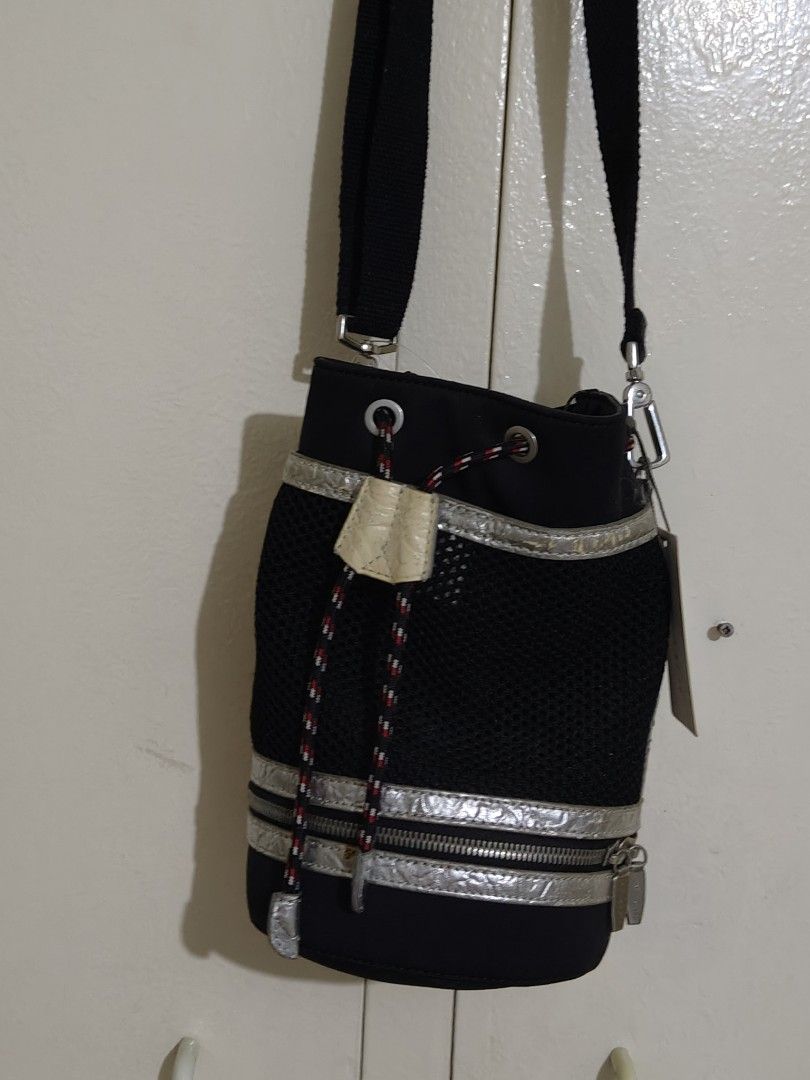 CHARLES & KEITH BUCKET CROSD BODY BAG (Category: Cross-body Bags) located in Cainta. Submitted by relove.finds_2020 (Listing ID 1463714927, Image 3). Description: - CHARLES & KEITH BUCKET CROSS BODY BAG - WITH TAG (NOT USED| JUST KEPT) - MINOR ISSUE: SILVER TRIM HAS FADED - STILL STURDY AND FULLY FUNCTIONAL.