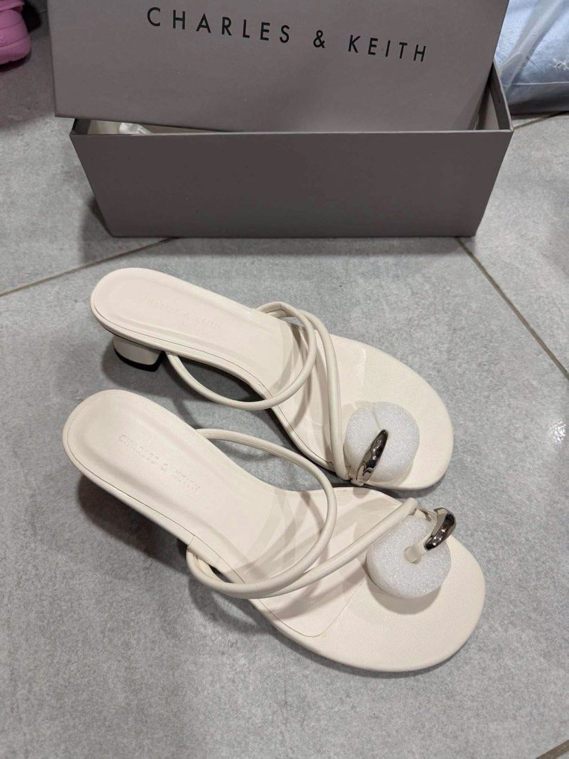 Charles & Keith Cream Toe Loop Block Heels Sandals (Category: Heels) located in Quezon City. Submitted by maleja07 (Listing ID 1463586091, Image 1). Description: - Available sizes: 36-39 - Style: Toe loop sandals - Heel: Low block heel - Versatility: Super chic, great for dressing up or down .