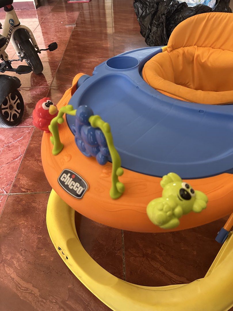 Chicco Baby Walker with Toys (Category: Infant Playtime) located in San Pedro. Submitted by jannesb (Listing ID 1463740547, Image 2). Description: - Brightly colored Chicco baby walker (orange, blue, and yellow). - Features interactive toys for baby's entertainment. - Padded and comfortable seat for your little one. - Ideal for helping babies explore and learn to walk. - Easy to clean and maintain. - Ready for its next adventure!.