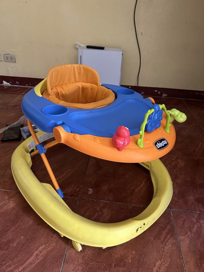 Chicco Baby Walker with Toys (Category: Infant Playtime) located in San Pedro. Submitted by jannesb (Listing ID 1463740547, Image 1). Description: - Brightly colored Chicco baby walker (orange, blue, and yellow). - Features interactive toys for baby's entertainment. - Padded and comfortable seat for your little one. - Ideal for helping babies explore and learn to walk. - Easy to clean and maintain. - Ready for its next adventure!.