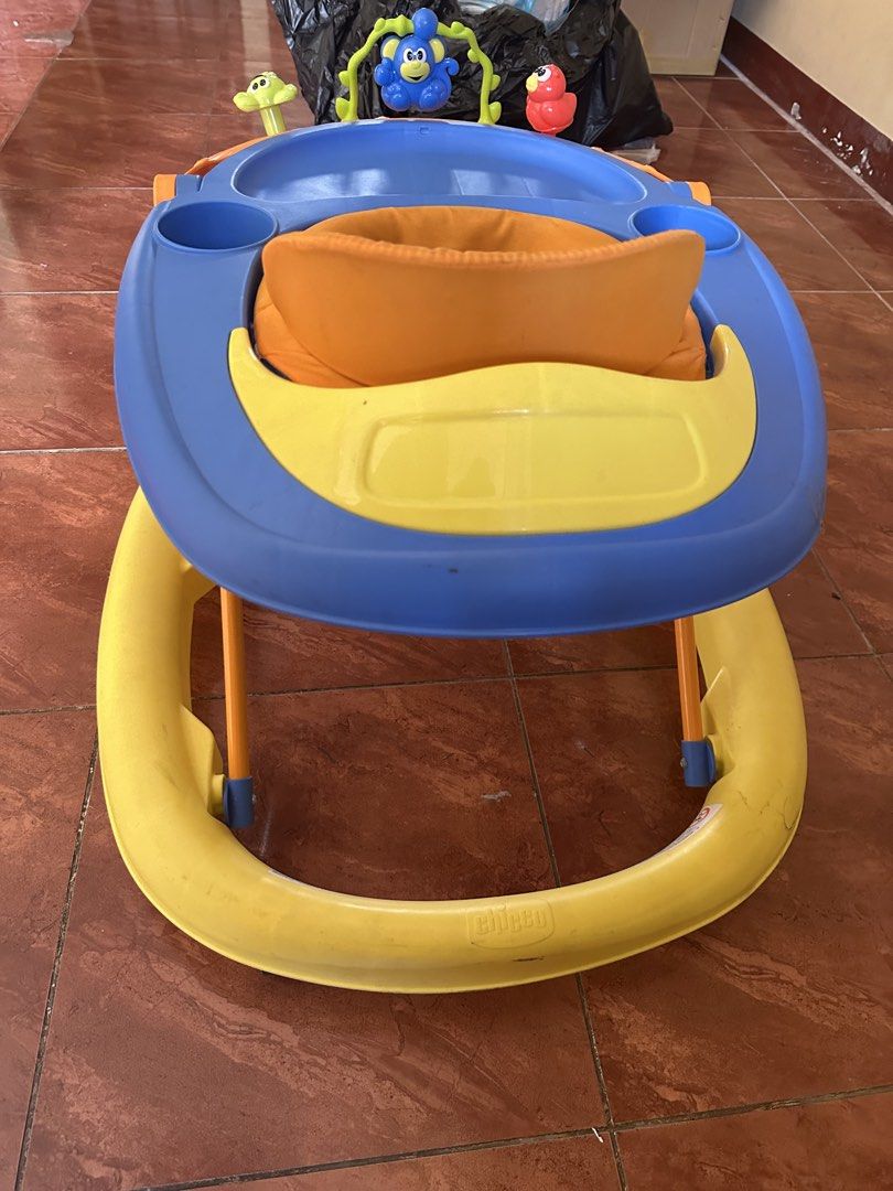 Chicco Baby Walker with Toys (Category: Infant Playtime) located in San Pedro. Submitted by jannesb (Listing ID 1463740547, Image 3). Description: - Brightly colored Chicco baby walker (orange, blue, and yellow). - Features interactive toys for baby's entertainment. - Padded and comfortable seat for your little one. - Ideal for helping babies explore and learn to walk. - Easy to clean and maintain. - Ready for its next adventure!.