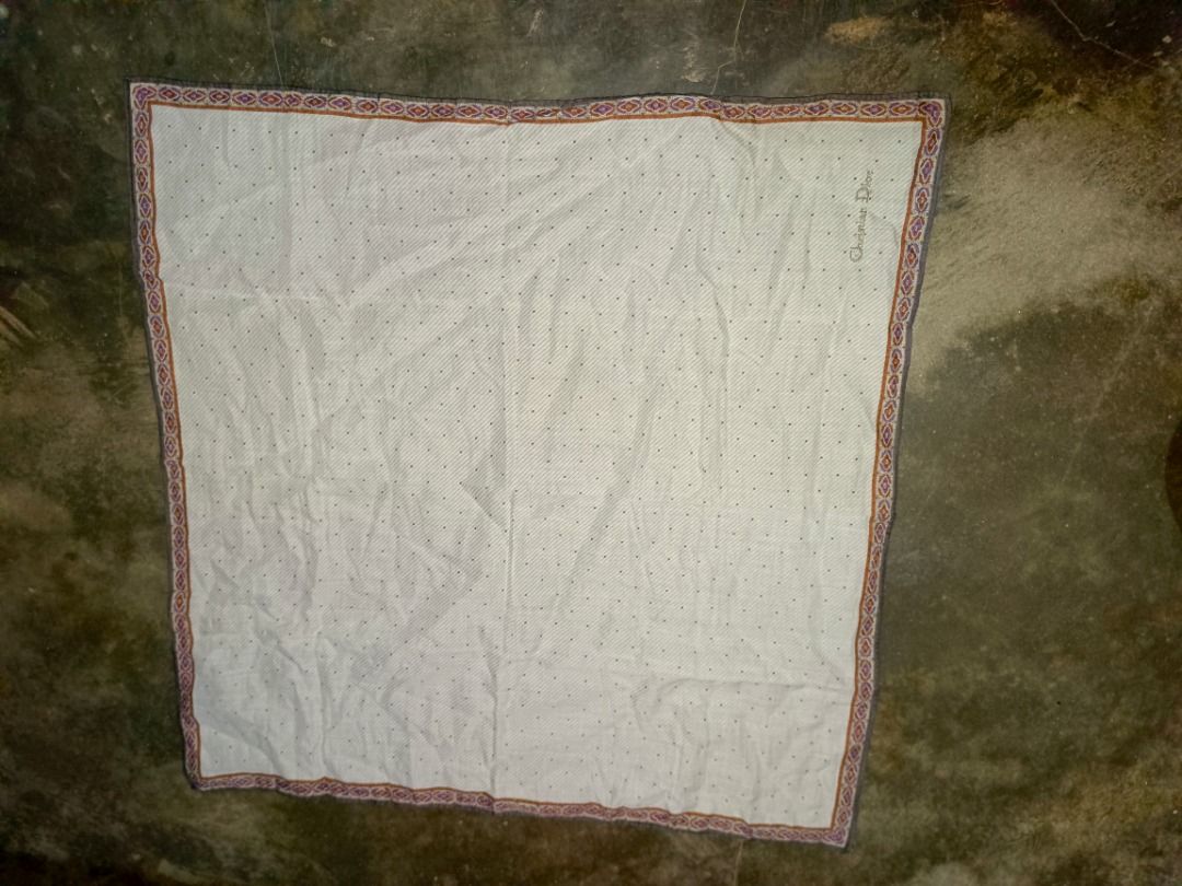 Christian Dior (Category: Luxury Accessories) located in Caloocan City. Submitted by jie_theseller17 (Listing ID 1463672983, Image 1). Description: - Authentic Christian Dior pocket square - Classic white with subtle dot pattern - Features a decorative border - Perfect accessory to elevate your style - Approximate measurements: 16x16 inches - Clean and ready for a new owner.