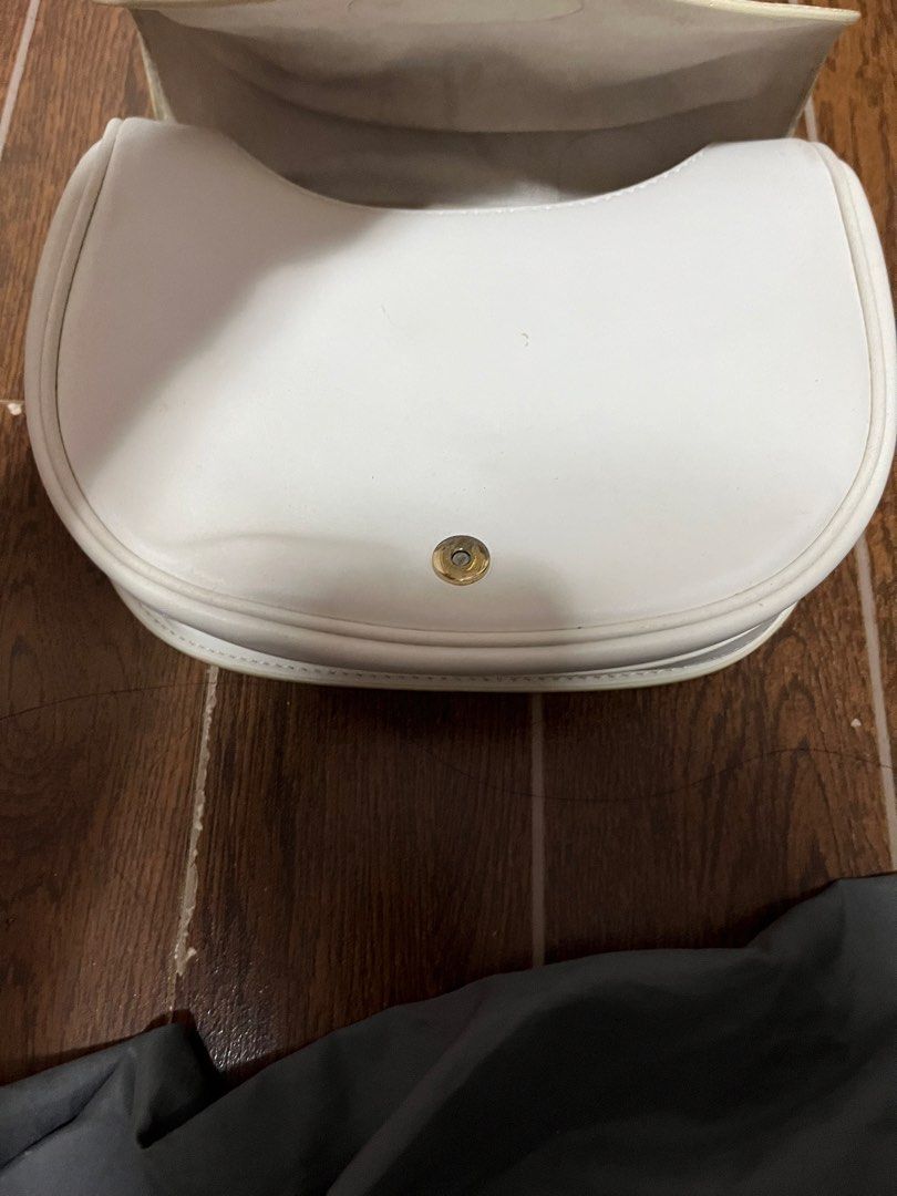 Christian Dior CD Logo White Leather Shoulder Bag (Category: Luxury Bags & Wallets) located in Victorias. Submitted by lan1877 (Listing ID 1463608087, Image 3). Description: - Iconic gold hardware CD logo clasp - Adjustable shoulder strap - Made in Italy - Exterior in clean condition Issue nsa last pics Rank a - Interior shows some signs of use.
