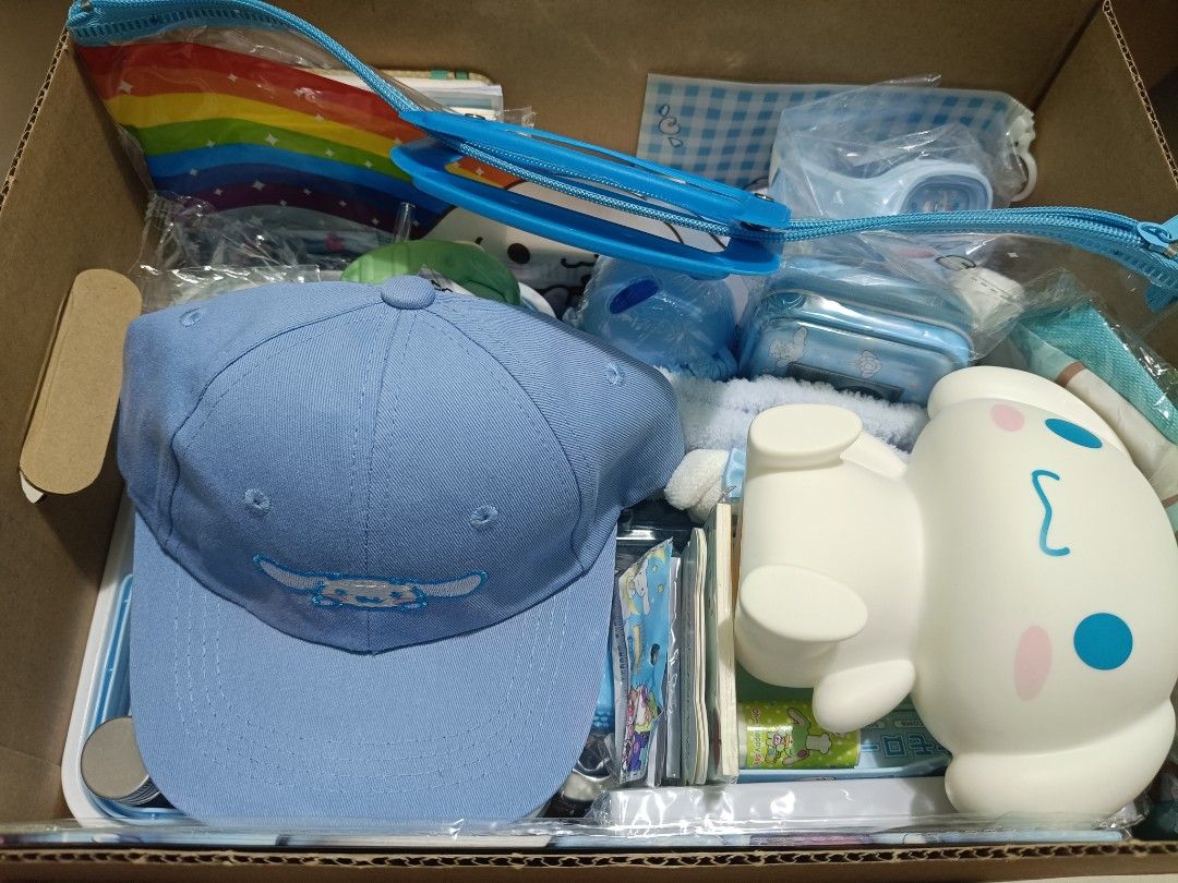 Cinnamoroll Cap, Storage Box, Mini Fan & Plush Toy Set (Category: Plushies & Soft Toys) located in Imus. Submitted by mrpp03 (Listing ID 1463693296, Image 1). Description: - Light blue Cinnamoroll embroidered cap - Cute storage box featuring Cinnamoroll - Mini handheld Cinnamoroll themed fan - Soft, pastel Cinnamoroll plush toy - Ideal gift for any Cinnamoroll enthusiast! PLEASE CHECK LAST PICTURE FOR ALL THE ITEMS INCLUDED. ITEMS ARE IN BIG BROW