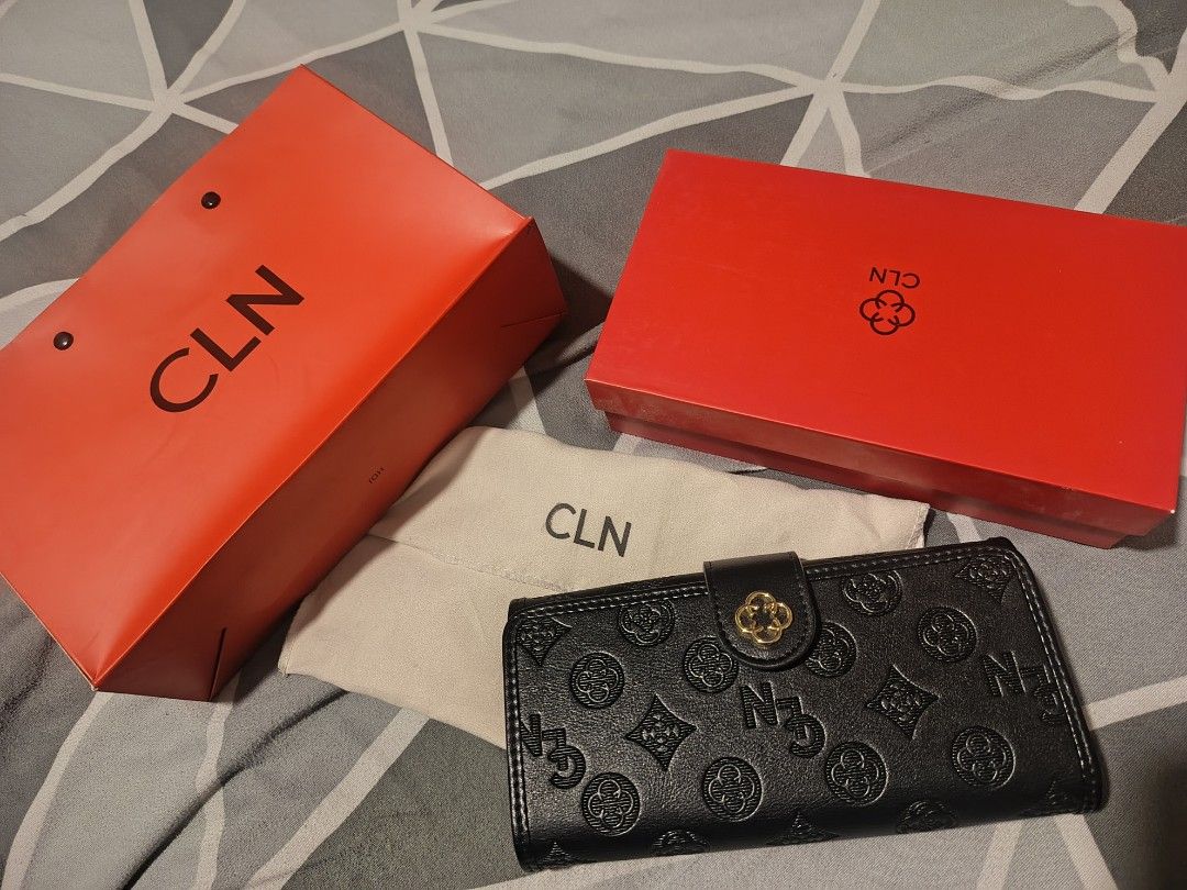 CLN Black Embossed Monogram Wallet with Pouch and Box (Category: Wallets & Card holders) located in Quezon City. Submitted by zai091995 (Listing ID 1463686453, Image 1). Description: - Black CLN wallet with embossed monogram pattern - Features gold hardware detail on the clasp - Comes with original dust pouch, CLN box, and shopping bag - Ideal for organizing your essentials.