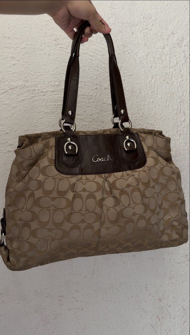 Coach Ashley (Category: Luxury Bags & Wallets) located in Imus. Submitted by thebag_stop.948 (Listing ID 1463719423, Image 1). Description: - Dark brown leather trim and handles - Spacious interior for essentials - Shows some wear on bottom corners.