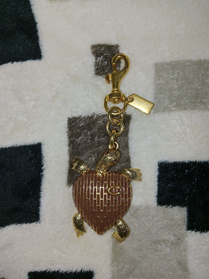 Coach brown turtle charm (Category: Craft Supplies & Tools) located in Baguio. Submitted by aurumsie (Listing ID 1463628176, Image 1). Description: insp*red gold hardware.