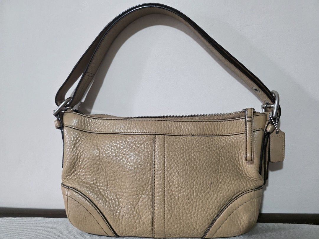 Coach Leather Shoulder Bag Tan (Category: Luxury Bags & Wallets) located in Santo Tomas. Submitted by kendra_04 (Listing ID 1463611366, Image 1). Description: Coach tan leather shoulder bag. Pebbled leather, zipper closure, interior pockets, silver hardware, and Coach tag. Perfect for daily use..