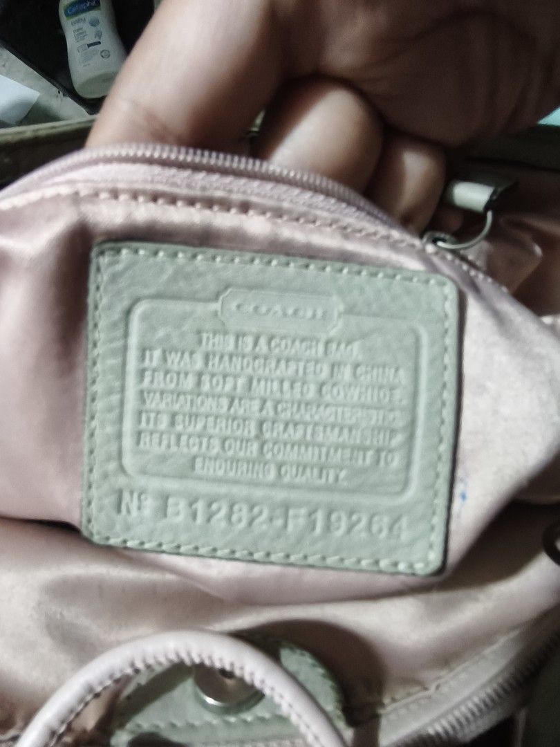 Coach Leather Tote Bag (Category: Luxury Bags & Wallets) located in Plaridel. Submitted by julleyuuuh (Listing ID 1463592250, Image 3). Description: - Light grey Coach leather tote bag - Soft leather construction - Front pocket with secure turn-lock closure - Satin-lined interior - Note: Some fraying on the bottom edge of the front pocket - Ideal for carrying your daily essentials.