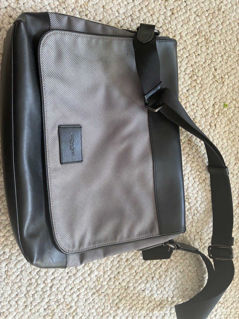 Coach Messenger Bag Black Grey Leather Nylon (Category: Sling Bags) located in Cabuyao City. Submitted by chinitopoohbear (Listing ID 1463563516, Image 1). Description: - Coach messenger bag - Black leather and grey textured nylon - Adjustable shoulder strap - Magnetic snap closure - Interior main compartment and pockets - Perfect for daily use or travel - Clean inside and out.