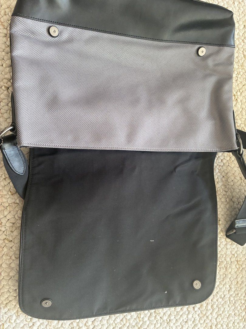 Coach Messenger Bag Black Grey Leather Nylon (Category: Sling Bags) located in Cabuyao City. Submitted by chinitopoohbear (Listing ID 1463563516, Image 3). Description: - Coach messenger bag - Black leather and grey textured nylon - Adjustable shoulder strap - Magnetic snap closure - Interior main compartment and pockets - Perfect for daily use or travel - Clean inside and out.