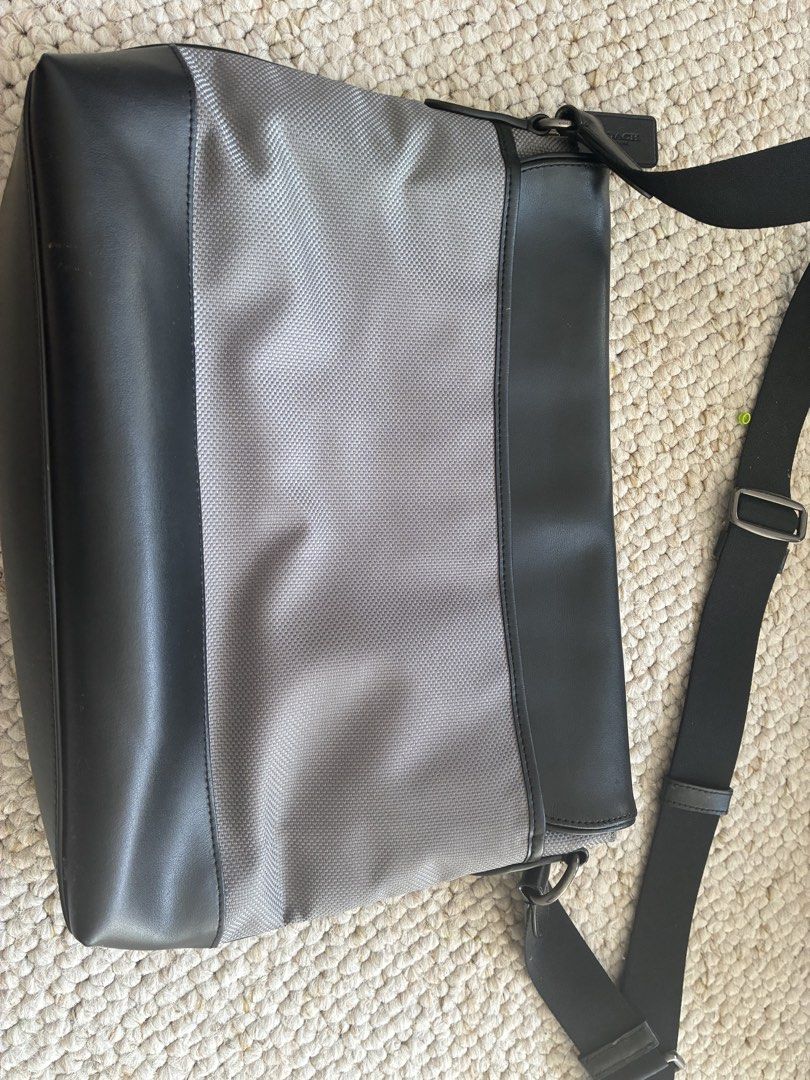 Coach Messenger Bag Black Grey Leather Nylon (Category: Sling Bags) located in Cabuyao City. Submitted by chinitopoohbear (Listing ID 1463563516, Image 2). Description: - Coach messenger bag - Black leather and grey textured nylon - Adjustable shoulder strap - Magnetic snap closure - Interior main compartment and pockets - Perfect for daily use or travel - Clean inside and out.