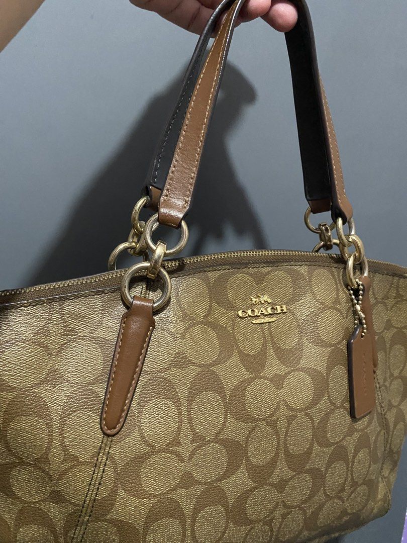 Coach Monogram Canvas Leather Trim Tote Bag (Category: Shoulder Bags) located in Batangas. Submitted by bagstolove3.0 (Listing ID 1463688265, Image 3). Description: - Coach monogram tote bag - Classic brown and tan signature 'C' pattern - Genuine leather trim and handles - Elegant gold hardware details - Secure zipper closure - Comes with original Coach hangtag - Perfect everyday companion - No sling.