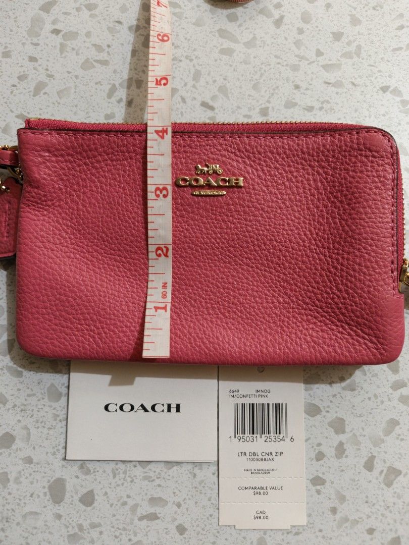 Coach Pink Leather Double Zip Wristlet (Category: Wallets & Card holders) located in Mandaluyong City. Submitted by TRES_MARIAS_SHOP (Listing ID 1463578382, Image 2). Description: - Bright pink Coach wristlet - Pebbled leather material - Double zip closure - Gold hardware - Detachable wrist strap - Interior card slots - Comes with original tags.