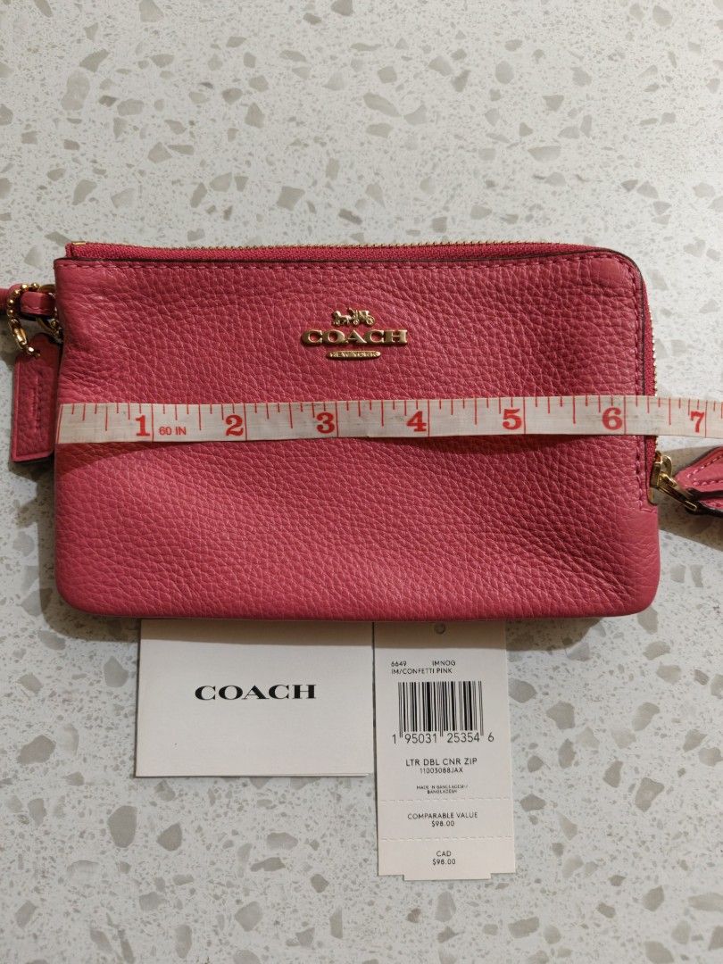 Coach Pink Leather Double Zip Wristlet (Category: Wallets & Card holders) located in Mandaluyong City. Submitted by TRES_MARIAS_SHOP (Listing ID 1463578382, Image 1). Description: - Bright pink Coach wristlet - Pebbled leather material - Double zip closure - Gold hardware - Detachable wrist strap - Interior card slots - Comes with original tags.